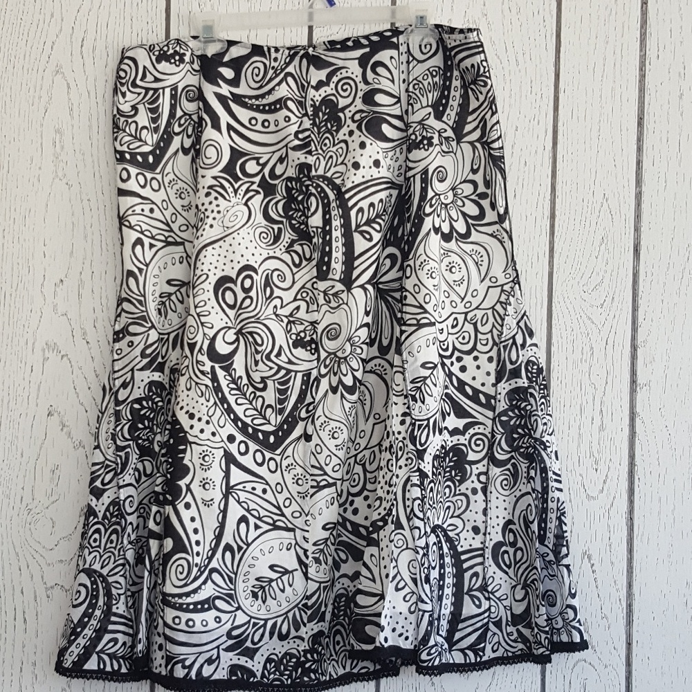 Avenue 16 white with black patterned skirt.